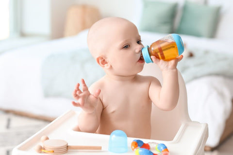 toddler drinking juice